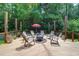 Spacious wooden deck with outdoor seating, fire pit and natural surroundings at 9133 Markleys Grove Blvd, Summerville, SC 29485