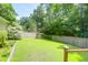 Lush green backyard with a well-maintained lawn and a wooden fence, providing privacy at 9133 Markleys Grove Blvd, Summerville, SC 29485