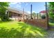 Spacious backyard with a wooden deck, screened-in porch, and lush green lawn at 9133 Markleys Grove Blvd, Summerville, SC 29485