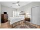 Bright bedroom with ceiling fan, warm wood floors and a stylish rug at 9133 Markleys Grove Blvd, Summerville, SC 29485