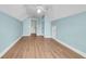 Empty bonus room features light blue walls, modern flooring, a ceiling fan, and entry to additional rooms at 9133 Markleys Grove Blvd, Summerville, SC 29485