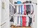 Well-organized walk-in closet with dual hanging rods, top shelving, and ample storage for clothing and personal items at 9133 Markleys Grove Blvd, Summerville, SC 29485
