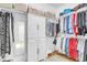Organized walk-in closet with built-in storage and ample hanging space for clothes and accessories at 9133 Markleys Grove Blvd, Summerville, SC 29485