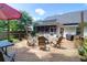 Spacious outdoor deck with comfortable seating, an umbrella, and a fire pit, ideal for entertaining at 9133 Markleys Grove Blvd, Summerville, SC 29485