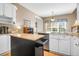 Modern kitchen with white cabinetry, granite countertops, stainless appliances, and center island at 9133 Markleys Grove Blvd, Summerville, SC 29485