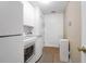 Clean and bright laundry room featuring modern washer and dryer units, storage cabinets, and white walls at 9133 Markleys Grove Blvd, Summerville, SC 29485