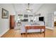 Bright living room featuring hardwood floors, vaulted ceilings, a fireplace, and lots of windows at 9133 Markleys Grove Blvd, Summerville, SC 29485