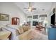 Inviting living room with a vaulted ceiling, hardwood floors, a fireplace, and lots of seating at 9133 Markleys Grove Blvd, Summerville, SC 29485
