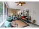 Relaxing screened-in porch with seating and ceiling fan at 9133 Markleys Grove Blvd, Summerville, SC 29485
