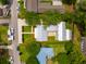 Aerial view of a home with well-maintained lawns, multiple structures, and surrounding greenery at 922 Kincade Dr, Mount Pleasant, SC 29464