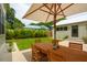 Lush backyard with patio table and chairs, perfect for outdoor entertaining at 922 Kincade Dr, Mount Pleasant, SC 29464