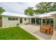 Inviting backyard with green lawn, gravel area, and outdoor seating at 922 Kincade Dr, Mount Pleasant, SC 29464