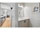 Elegant bathroom with marble countertop, white cabinets, and modern lighting at 922 Kincade Dr, Mount Pleasant, SC 29464