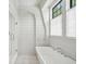 Luxurious bathroom featuring a soaking tub, separate shower, and natural light at 922 Kincade Dr, Mount Pleasant, SC 29464