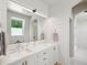Elegant bathroom featuring double sinks, shiplap walls, and modern finishes at 922 Kincade Dr, Mount Pleasant, SC 29464