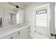 Bathroom with white marble countertop, sink, black hardware and large mirror at 922 Kincade Dr, Mount Pleasant, SC 29464