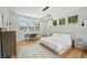 Inviting bedroom with hardwood floors, large windows, and modern light fixture at 922 Kincade Dr, Mount Pleasant, SC 29464