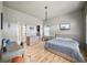 Bedroom featuring hardwood floor, light colored walls, light-colored wood furniture and a door to a walk-in closet at 922 Kincade Dr, Mount Pleasant, SC 29464