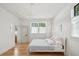 Bright bedroom with stylish, modern lighting, neutral decor, and wood flooring at 922 Kincade Dr, Mount Pleasant, SC 29464