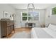 Bedroom featuring rustic dresser, desk, and modern lighting at 922 Kincade Dr, Mount Pleasant, SC 29464