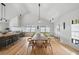 Bright dining room featuring a wooden table, large windows, and wooden flooring at 922 Kincade Dr, Mount Pleasant, SC 29464