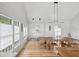 Bright dining room with vaulted ceilings, light wood floors, modern lighting, and multiple windows at 922 Kincade Dr, Mount Pleasant, SC 29464