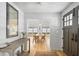 Bright entryway with hardwood floors and a view into the dining room with table and chairs at 922 Kincade Dr, Mount Pleasant, SC 29464