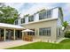 Charming home with a silver roof, outdoor patio, and manicured lawn at 922 Kincade Dr, Mount Pleasant, SC 29464
