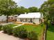 Stunning single-story home with a well-manicured lawn, lush landscaping, and a modern aesthetic at 922 Kincade Dr, Mount Pleasant, SC 29464