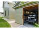 Spacious garage with an automatic door, interior organization, and space for parking a golf cart at 922 Kincade Dr, Mount Pleasant, SC 29464