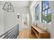 Bright hallway features hardwood floors, shiplap walls, and views to the outside at 922 Kincade Dr, Mount Pleasant, SC 29464