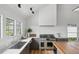 Bright kitchen with white shiplap, gray cabinets, stainless steel appliances, and marble countertops at 922 Kincade Dr, Mount Pleasant, SC 29464