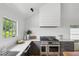 Modern kitchen with stainless steel range, gray cabinets, marble counters, and bright window at 922 Kincade Dr, Mount Pleasant, SC 29464