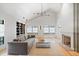Bright living room with tall ceilings, large windows, and a cozy fireplace at 922 Kincade Dr, Mount Pleasant, SC 29464