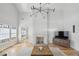 Bright living room features a modern light fixture, a fireplace, and hardwood floors at 922 Kincade Dr, Mount Pleasant, SC 29464