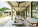 Relaxing covered patio featuring ceiling fans and comfortable seating with a view of the backyard at 922 Kincade Dr, Mount Pleasant, SC 29464