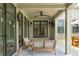 Covered outdoor patio with modern seating, ceiling fan, and outdoor lighting at 922 Kincade Dr, Mount Pleasant, SC 29464