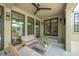 Outdoor patio with a ceiling fan, modern seating, and views of the landscaped backyard at 922 Kincade Dr, Mount Pleasant, SC 29464