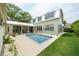 Backyard view with a pristine pool, patio, and lush lawn at 922 Kincade Dr, Mount Pleasant, SC 29464