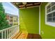Balcony view of green foliage and adjacent colorful townhomes offers a relaxing outdoor space at 9305 Sweetbay Ct, Ladson, SC 29456