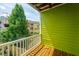 The balcony offers a scenic view of the lush backyard and neighboring colorful townhouses at 9305 Sweetbay Ct, Ladson, SC 29456
