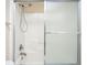 Bathtub and shower combination with shower head and sliding glass door at 9305 Sweetbay Ct, Ladson, SC 29456