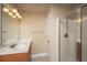Bright bathroom with vanity, mirrored wall, and glass enclosed shower at 9305 Sweetbay Ct, Ladson, SC 29456