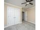 Spacious bedroom with a ceiling fan and large double-door closet at 9305 Sweetbay Ct, Ladson, SC 29456