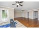 Spacious bonus room with hardwood floors, two ceiling fans, and access to the backyard at 9305 Sweetbay Ct, Ladson, SC 29456