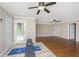 Spacious bonus room with hardwood floors, two ceiling fans, and access to the backyard at 9305 Sweetbay Ct, Ladson, SC 29456