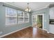 Sunny dining area featuring hardwood floors, a chandelier, and lots of windows at 9305 Sweetbay Ct, Ladson, SC 29456