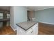 Open-concept kitchen with an island, stainless steel appliances, and views of the living and dining areas at 9305 Sweetbay Ct, Ladson, SC 29456