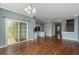 Open living area featuring hardwood floors, view to the kitchen and access to the backyard at 9305 Sweetbay Ct, Ladson, SC 29456