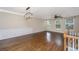 Bright living room with hardwood floors, decorative molding, and a modern chandelier at 9305 Sweetbay Ct, Ladson, SC 29456